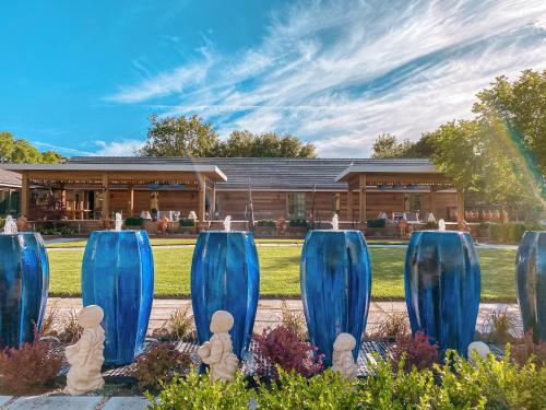 a group of blue sculptures in front of a building at Bann at Oak Knoll Napa in Napa