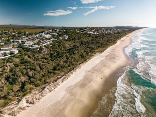 an aerial view of a beach with houses at Essence Peregian Beach Resort - Lily 4 Bedroom Luxury Home with Private Pool in Peregian Beach