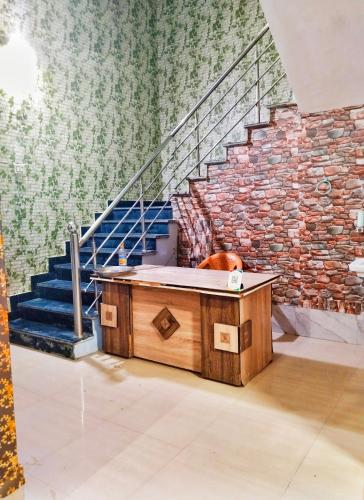 a wooden tub in a room with a staircase at Balaji homestay Mathura in Vrindavan in Mathura