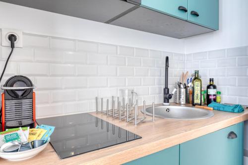 Virtuvė arba virtuvėlė apgyvendinimo įstaigoje Les Vignes de Montmartre - Studio