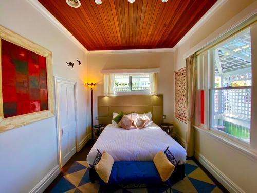 a bedroom with a bed and a window at Little bird in Smithton