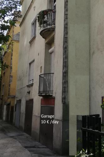 a building with a sign on the side of it at Villa with terrace overlooking the city park in Budapest
