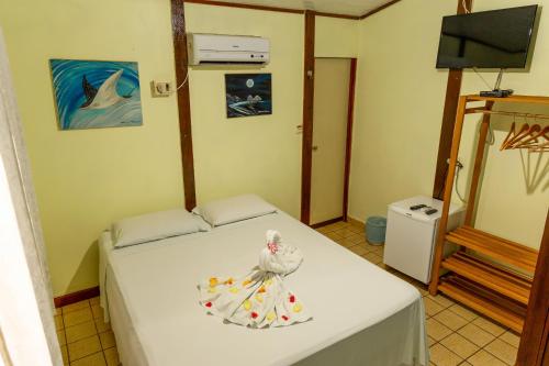 Cama o camas de una habitación en Pousada do Romildo