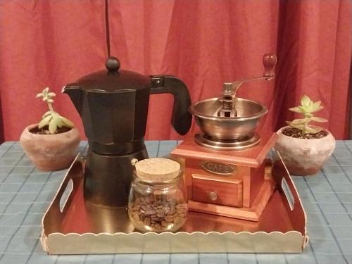 a coffee maker sitting on top of a table at Casa La Florida in La Serena