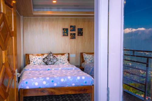 Ein Bett oder Betten in einem Zimmer der Unterkunft Rambler's Nesting Homestay