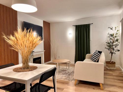 a living room with a white table and chairs at HideOut City in Riverview