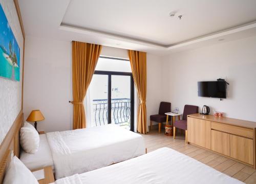 Giường trong phòng chung tại An Dương Hotel & Apartment