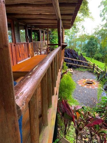 an outside view of a porch of a wooden cabin at Vista Turrialba Lodge in Turrialba