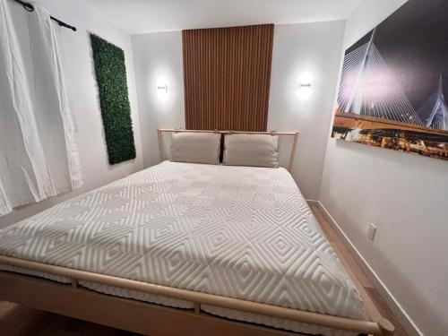 a small bedroom with a bed in a room at HideOut City in Riverview