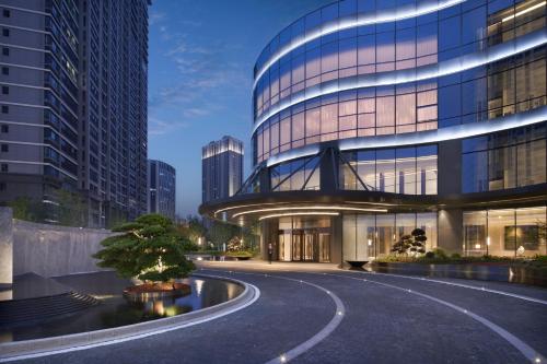 a rendering of a building with a road in front at Hyatt Regency Changshu Kuncheng Lake in Changshu