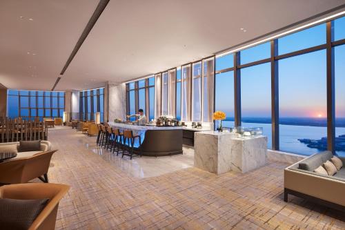 a hotel lobby with a view of the ocean at Hyatt Regency Changshu Kuncheng Lake in Changshu
