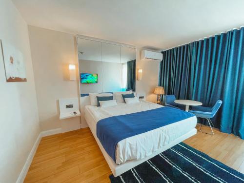 Postel nebo postele na pokoji v ubytování Batumi VIP hotel