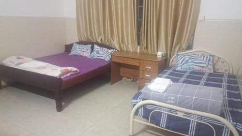 A bed or beds in a room at Guesthouse Restaurant