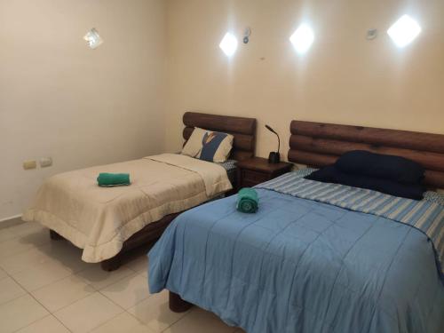 una camera con due letti di Corazón Abierto a Chicxulub