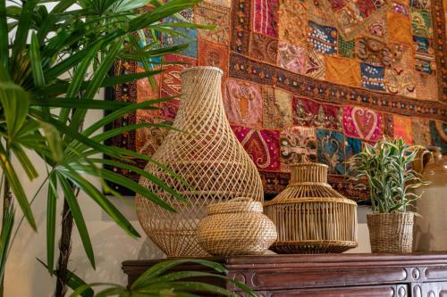 a group of vases sitting on top of a table at The Sun House in Galle