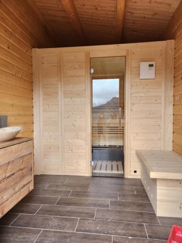 a wooden room with a sauna with a window at Lipphütte Top Lage mit traumhafter Aussicht in Rauris