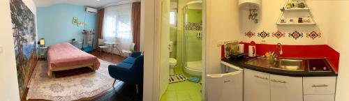 un baño con lavabo y ducha en Green Gate Apartments, en Sarajevo