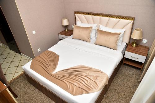 Кровать или кровати в номере Boulevard Rigs Boutique Hotel