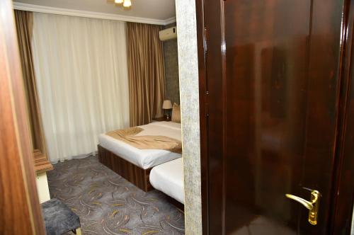Кровать или кровати в номере Boulevard Rigs Boutique Hotel