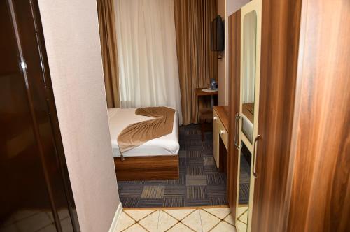 Кровать или кровати в номере Boulevard Rigs Boutique Hotel
