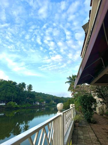 a view of a river from a balcony of a house at Hotel Riverside in Baga