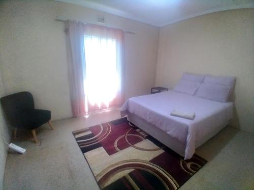 Ένα ή περισσότερα κρεβάτια σε δωμάτιο στο Lethabo Bed & Breakfast Bizana