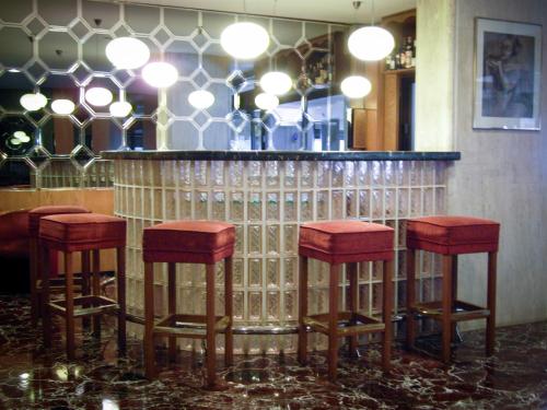 a group of four stools in a bar at Hotel Best in Ankara