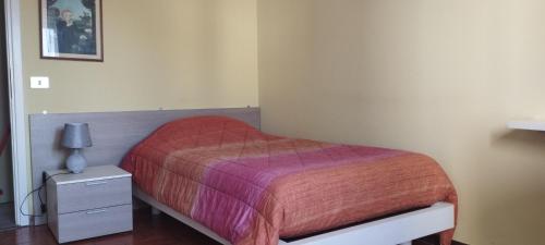 Postel nebo postele na pokoji v ubytování Appartamento a Castellarano Manzoni house