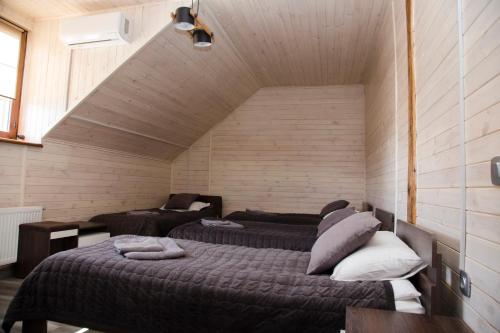 a bedroom with two beds in a room at Готель Бережани in Brzezhany