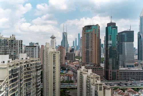 a view of a city with many tall buildings at Shanghai Yi Du B&B - Family Suite 500m to Nanjing West Rd Near People's Square -Credit Cards Accepted in Shanghai