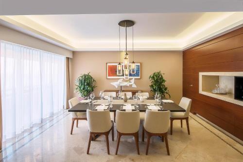 a dining room with a table and chairs at Grand Fiesta Americana Veracruz in Veracruz