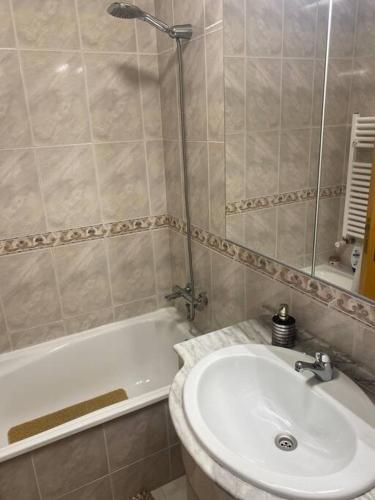 a bathroom with a toilet and a sink and a shower at Notre paradis à Sesimbra in Sesimbra