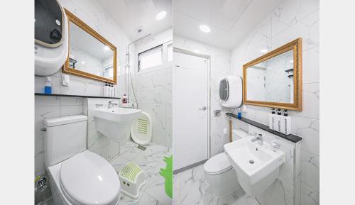 済州市にあるHomechee Kids Poolvillaのトイレと洗面台を備えた白いバスルーム