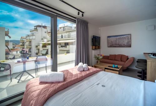 Ένα ή περισσότερα κρεβάτια σε δωμάτιο στο Nestia urban apartments