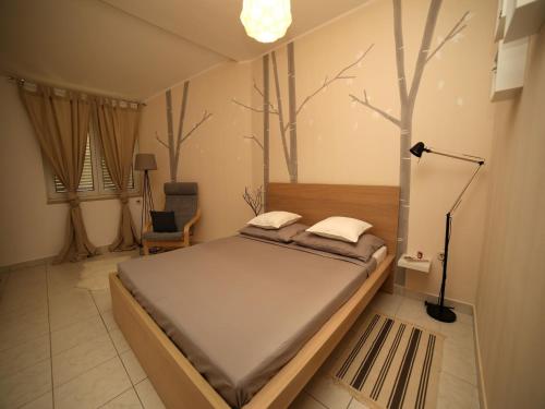 Katil atau katil-katil dalam bilik di Dandelion Apartment - free parking
