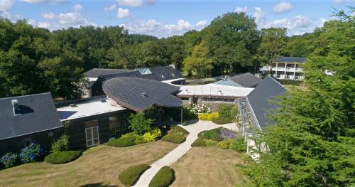 an aerial view of a house with a roof at Logis Hôtel Le Keréden in Locarn