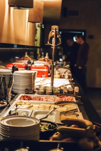a buffet line with many different types of food at Theresian Hotel in Olomouc