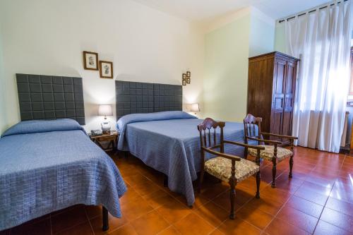 Katil atau katil-katil dalam bilik di Albergo Casentino