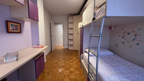 a room with two bunk beds and a hallway at Naia´s Living T3 in Bilbao