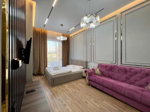 Ένα ή περισσότερα κρεβάτια σε δωμάτιο στο Стильные апартаменты в элитном комплексе