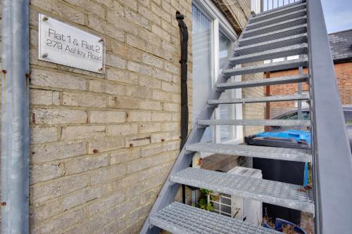 a metal ladder leaning against a brick building at 279 Ashley Road in Parkstone