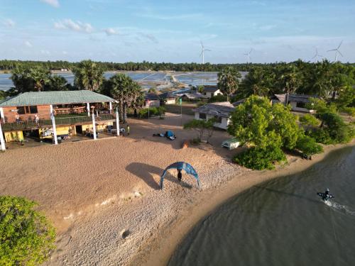 an overhead view of a beach with a person on it at MKS - Kite & Wing Foil camp in Kalpitiya