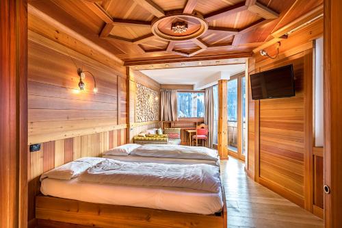 Postel nebo postele na pokoji v ubytování Hotel Dahu
