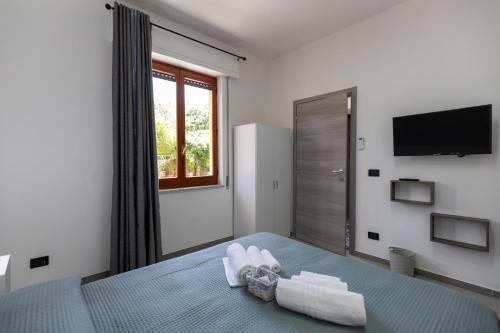 Postel nebo postele na pokoji v ubytování Residenza De Vita