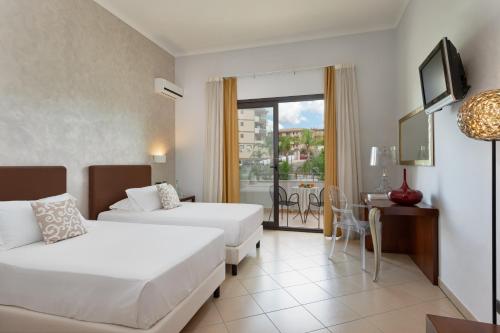 Postel nebo postele na pokoji v ubytování Grand Hotel Sofia