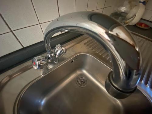 a kitchen sink with a water faucet at San15 in Predazzo