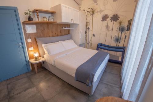 Ένα ή περισσότερα κρεβάτια σε δωμάτιο στο LaPortulaca Relax & Nature