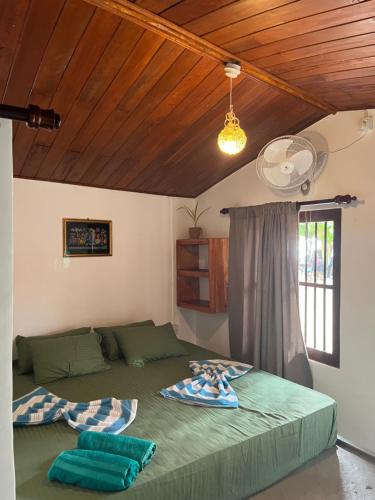 a bedroom with a bed with two pillows on it at Sabine Holiday Resort and Restaurant in Matara