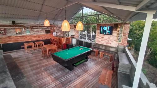 an overhead view of a pool table in a room at Bagus Ink Surf Camp in Uluwatu