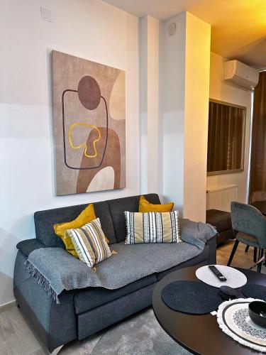a living room with a couch and a table at Sara Apartment in Strumica